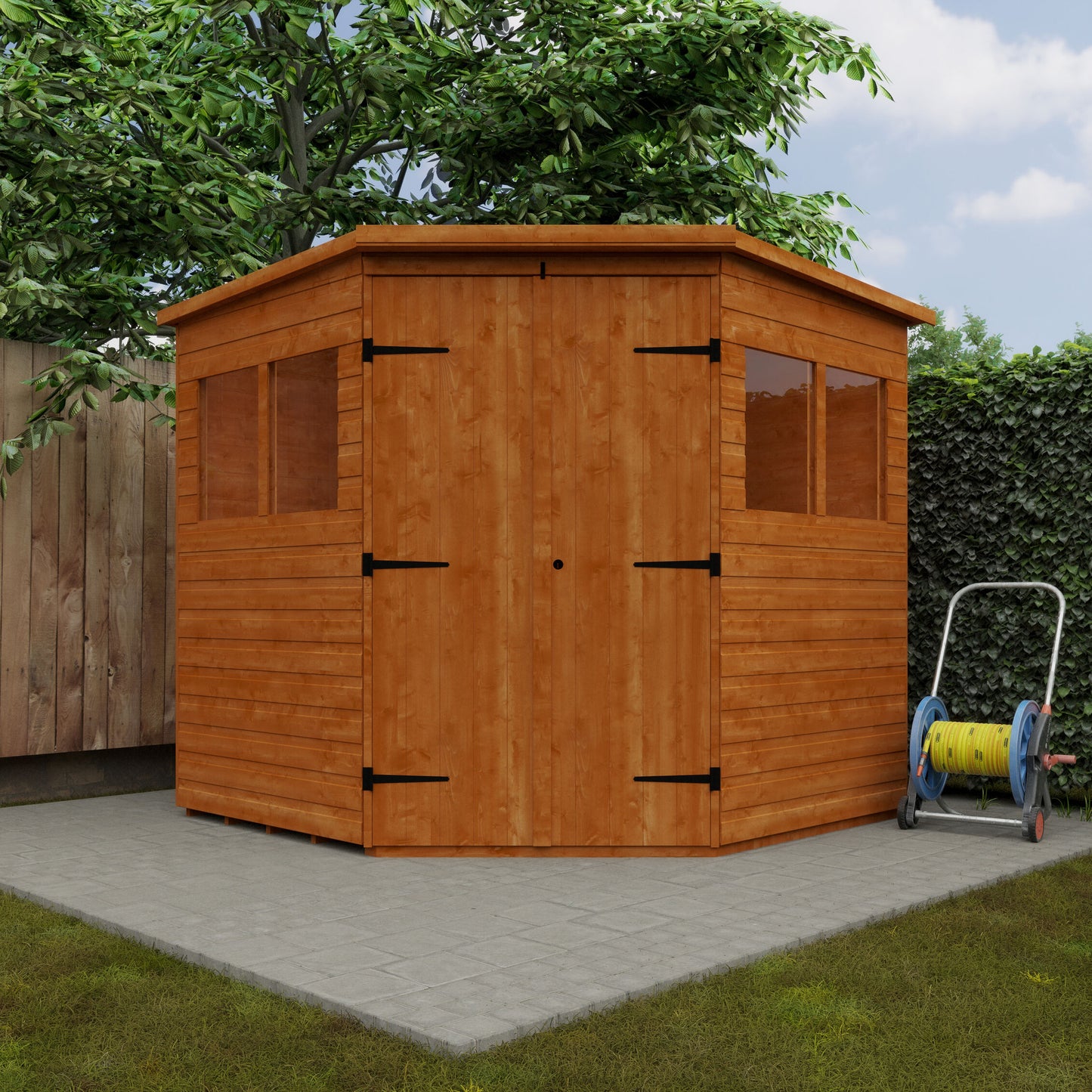 Corner Keeper wooden garden shed with loglap cladding, double doors, and green cushions on patio with trees and garden hose